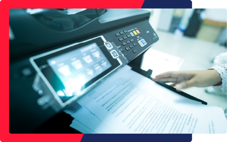 A professional printing out papers from the printer