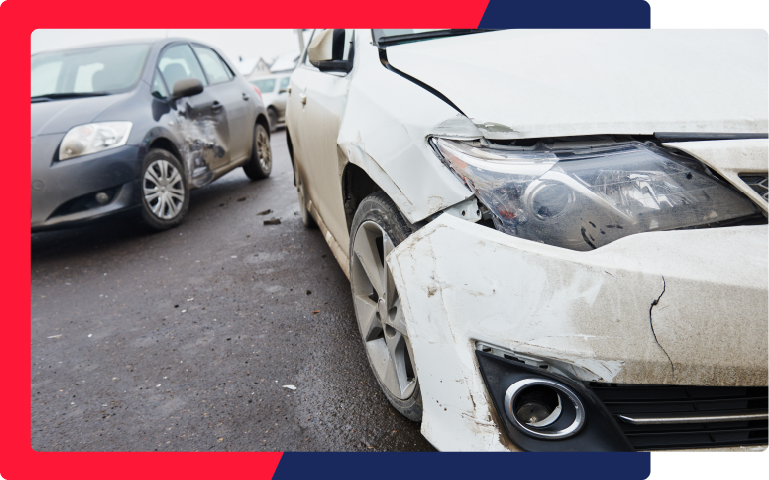 two cars damaged after colliding with one another